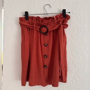 Dark burnt orange skirt.